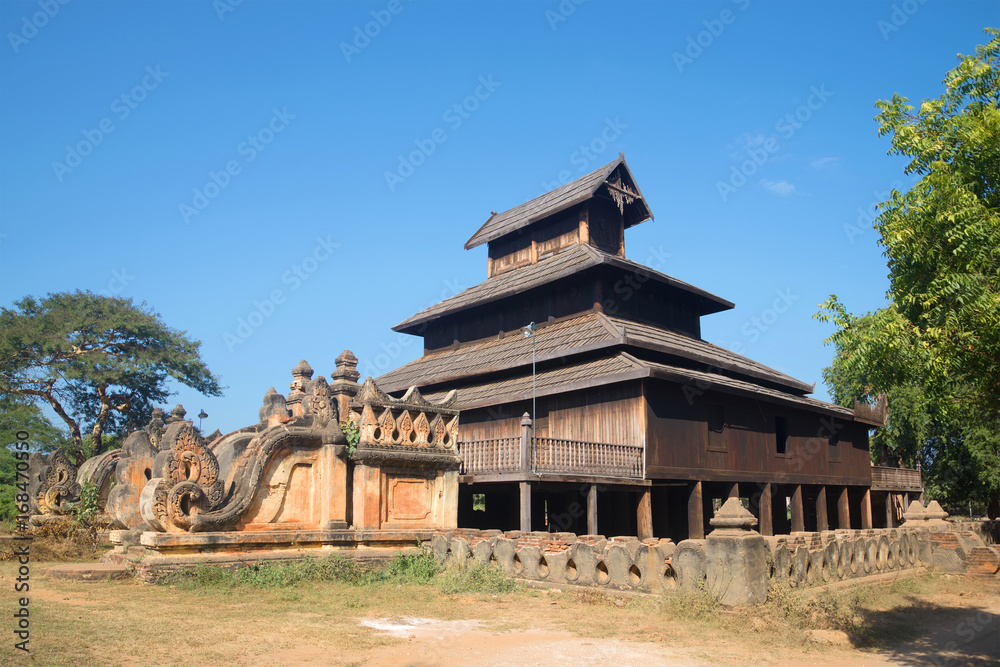 Ancient wooden Buddhist temple on a sunny afternoon. Old Bagan, Burma Ancient wooden Buddhist temple on a sunny afternoon. Old Bagan, Burma