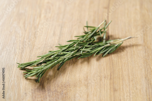 fresh rosemary bunch on wood table