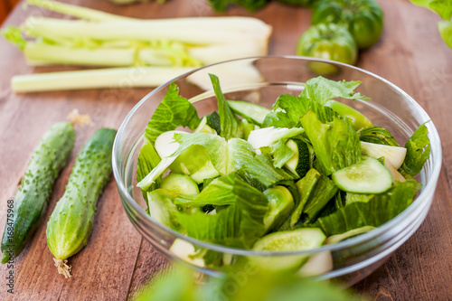 vegetable green salad bowl on kitchen table, balanced diet
