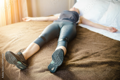 Woman having a rest after run and hard workout. photo