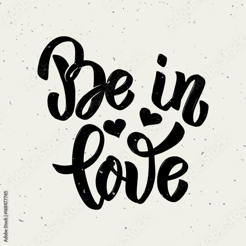Be in love. Hand drawn lettering phrase isolated on white background.
