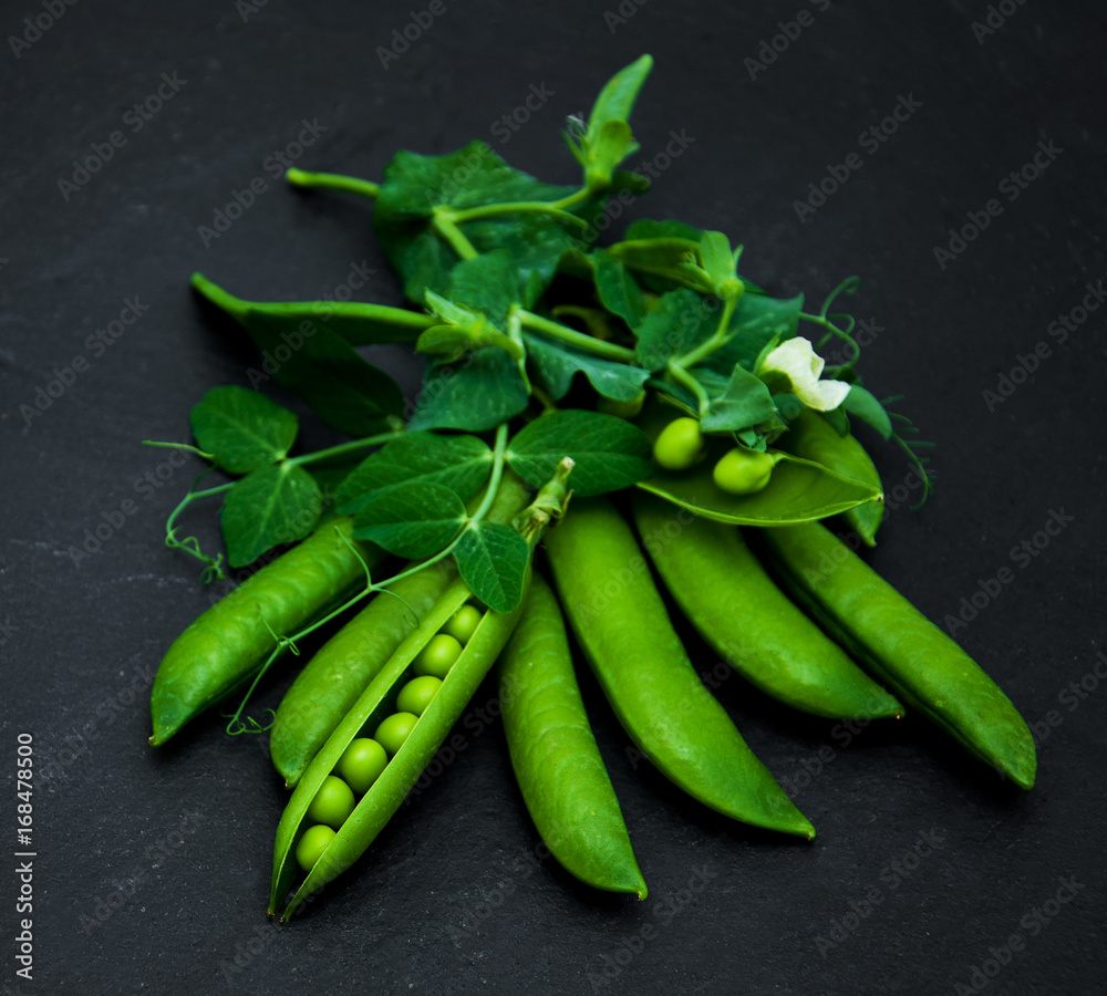 green peas on a stone background green peas on a stone background