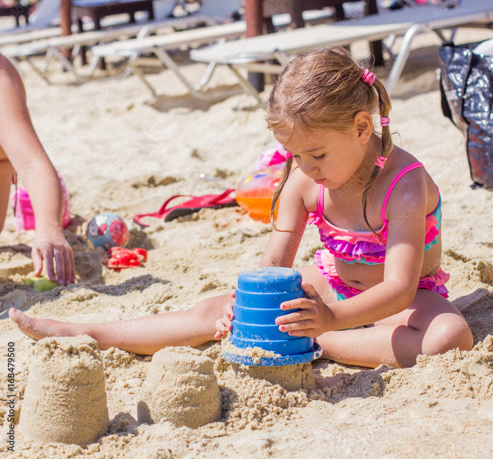 Little Girl Playing On The Beach Little Girl Playing On The Beach