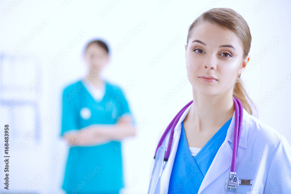 Fototapeta premium Attractive female doctor in front of medical group