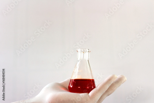 Wallpaper Mural Scientists holding test bottles on a white background. Torontodigital.ca