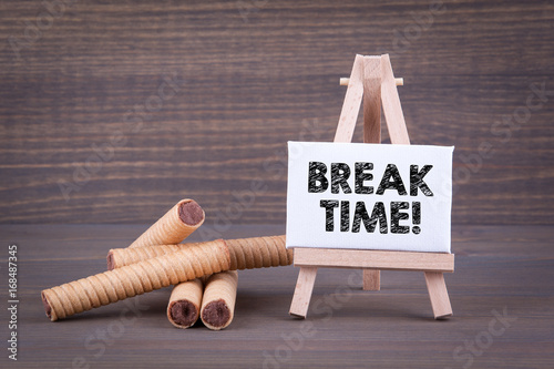 Break time. Biscuits with sweet filling on a wooden background. #168487345