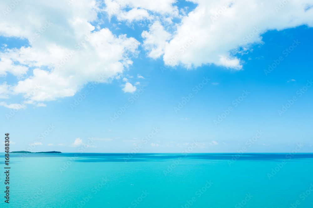 Beautiful summer blue sky and white clouds over calm sea in sunny day.