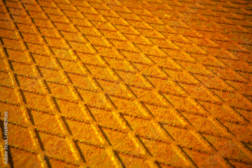 Old antislip corrugated and rusty metal plate - toned image