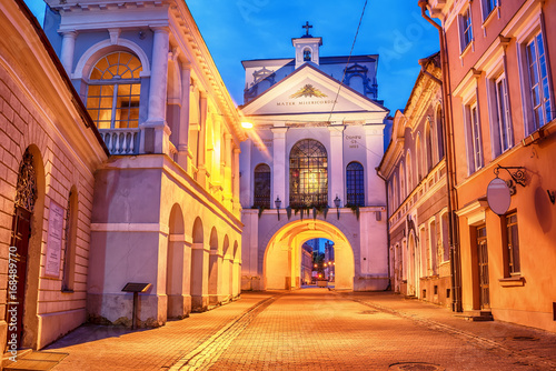 Vilnius, Lithuania: the Gate of Dawn, Lithuanian Ausros, Medininku vartai, Polish Ostra Brama, a city gate of Vilnius, one of its most important historical, cultural and religious monuments in sunrise