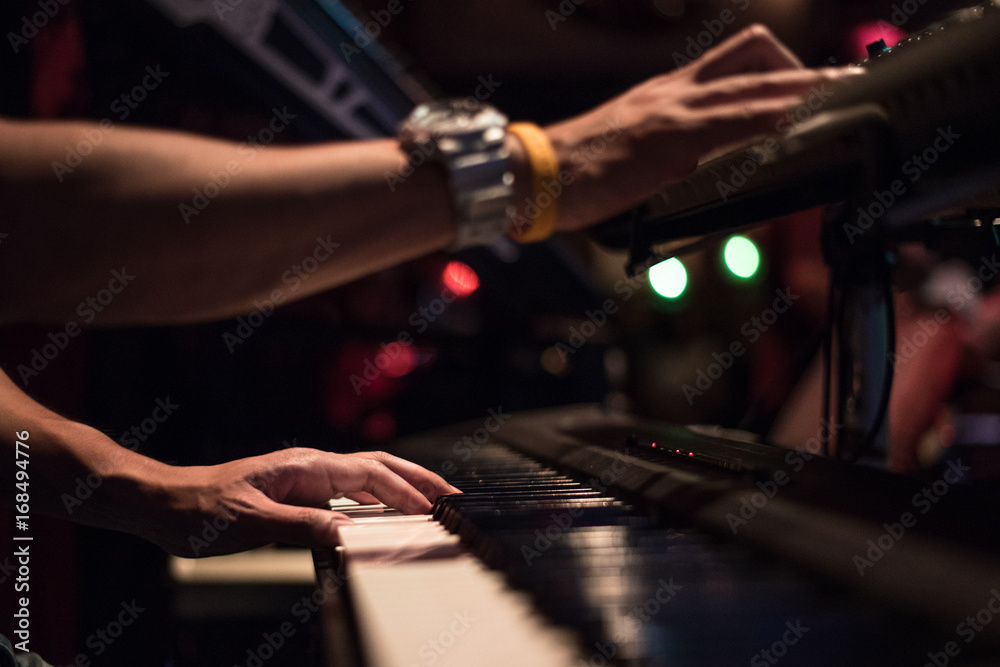Pianist hands playing beautiful and romantic music closeup. Live music performance.