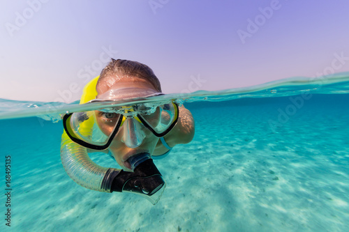 Snorkeling woman exploring beautiful ocean sealife