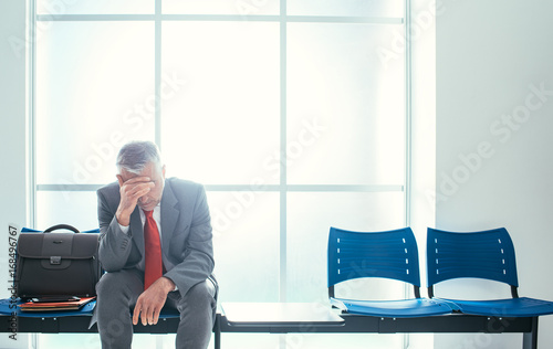 Depressed businessman in the waiting room