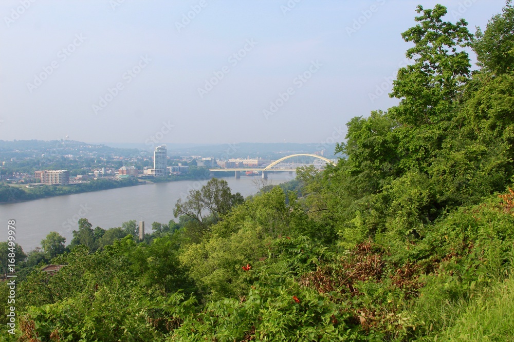 The yellow bridge and the river from the overlook on the hill.