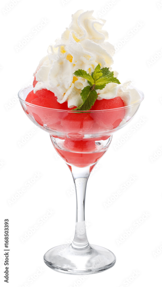 Balls of watermelon in a glass Cremant with whipped cream. Isolated on white. Balls of watermelon in a glass Cremant with whipped cream. Isolated on white.