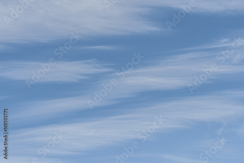 Blue skies with white cirrus clouds