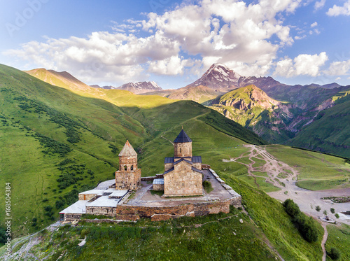 aerial. Gergeti orthodox church high in the mountains, Georgia photo