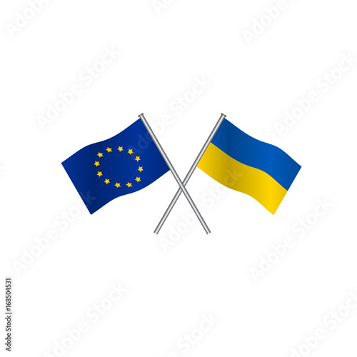 Crossing flags of Europe Union and Ukraine, candidate to entry in EU. Concpt of cooperation between the two countries