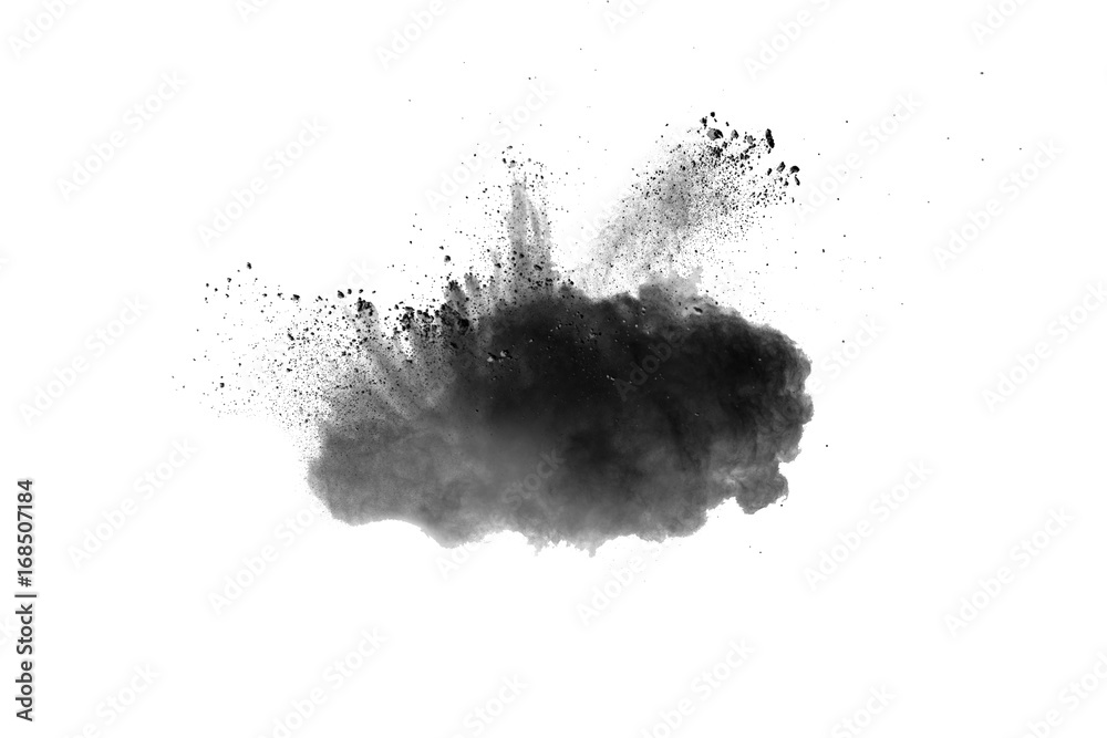 Black powder explosion. Closeup of black dust particles explode isolated on white background. Black powder explosion. Closeup of black dust particles explode isolated on white background.