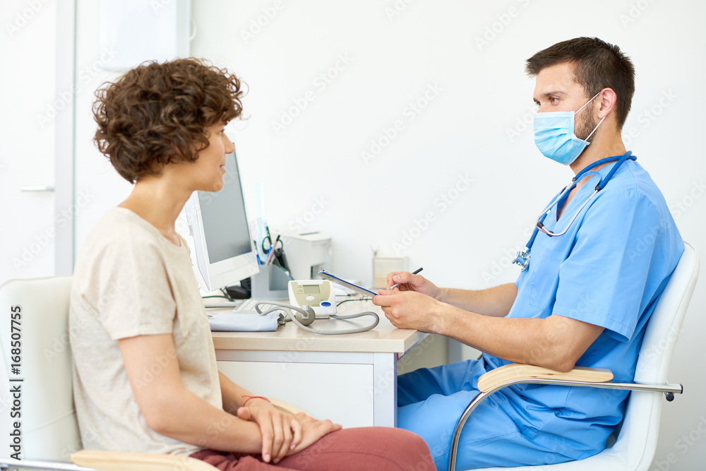 Fototapeta premium Young Doctor with Female Patient