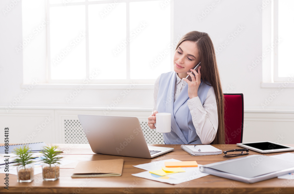 Business talk, woman consulting by phone at office Business talk, woman consulting by phone at office