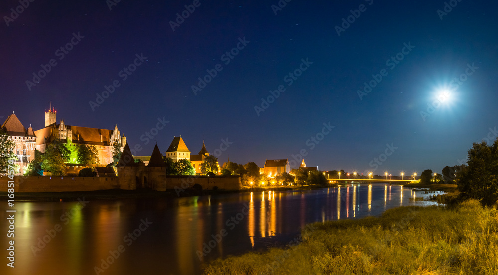 Night view of the castle Teutonic in Malbork, Poland