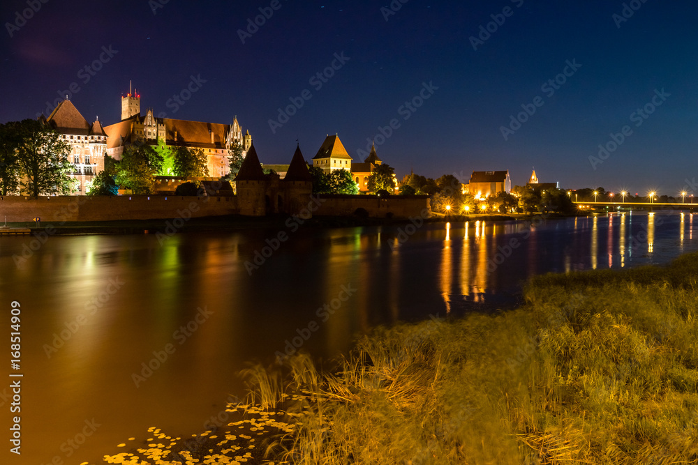 Night view of the castle Teutonic in Malbork, Poland