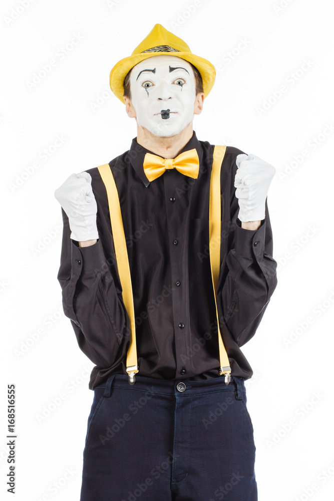 A happy young man, an actor, pantomime, rejoices in success. A happy young man, an actor, pantomime, rejoices in success.