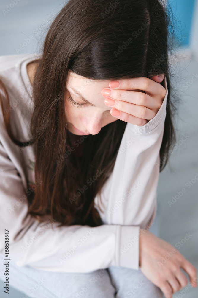 Fototapeta premium A woman sitting alone and depressed
