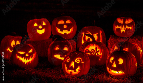 Fotografie Lighted Halloween Pumpkins with Candles