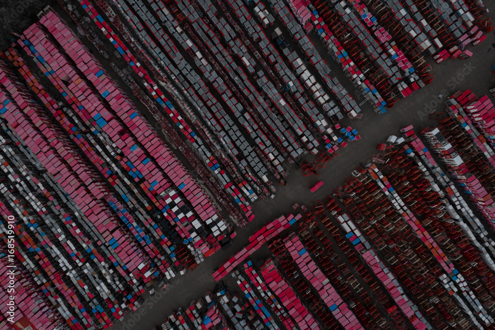 Warehouse containers in red on the street in the open air. Logistics center. Aerial view. From above Warehouse containers in red on the street in the open air. Logistics center. Aerial view. From above
