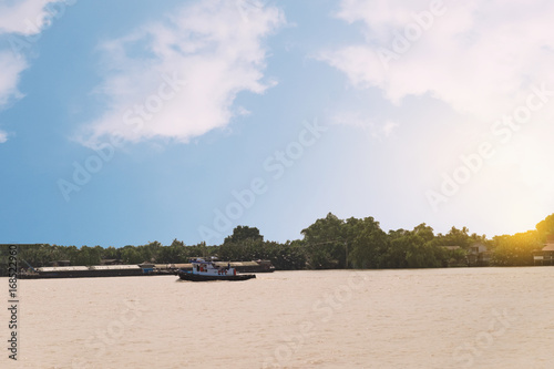 Fototapeta Naklejka Na Ścianę i Meble -  Life near the river with sunset scene