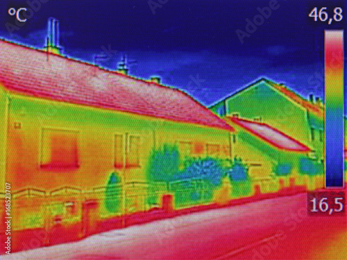 Infrared thermovision image showing lack of thermal insulation on Residential building photo