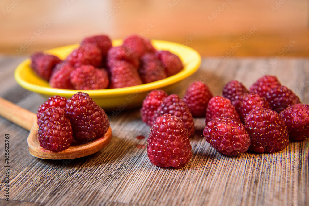 Fresh berries raspberry forest fruit on a wooden table Fresh berries raspberry forest fruit on a wooden table