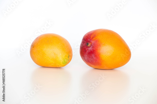 Fresh ripe mango,  shown on a light background
