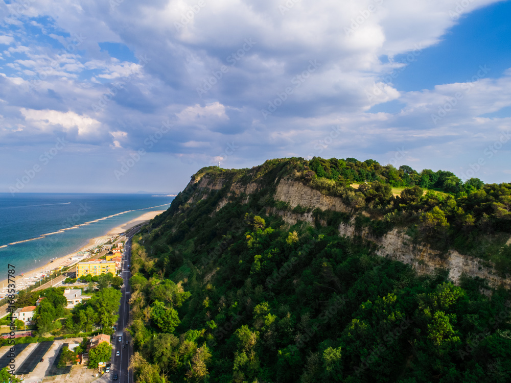 Cliff on the beach from above. Italy landscape.