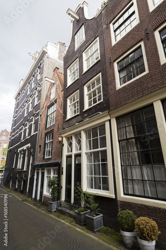 Traditional dutch narrow tall houses with contrasting window frames