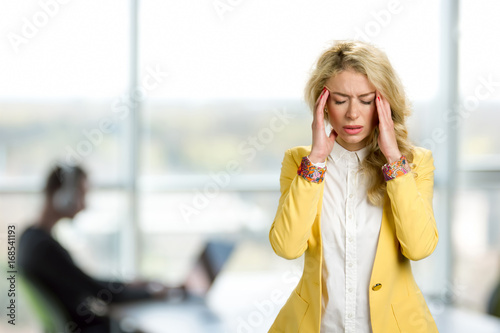 Φωτογραφία Young business woman with terrible headache