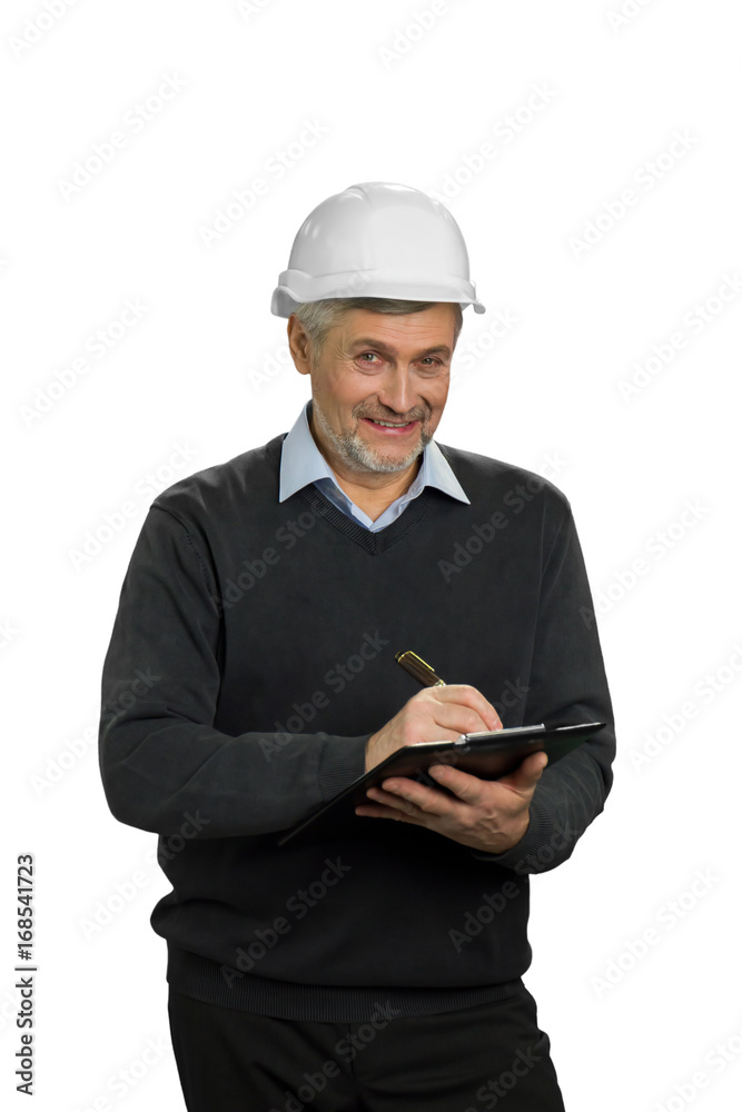 Smiling mature engineer, white background. Senior manual worker in hardhat checking new property. Mature contractor smiling and holding clipboard on white background. Smiling mature engineer, white background. Senior manual worker in hardhat checking new property. Mature contractor smiling and holding clipboard on white background.