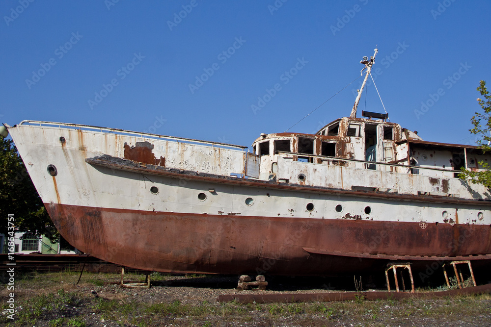 Rusty abandoned ship on the beach in Sukhum, Abkhazia