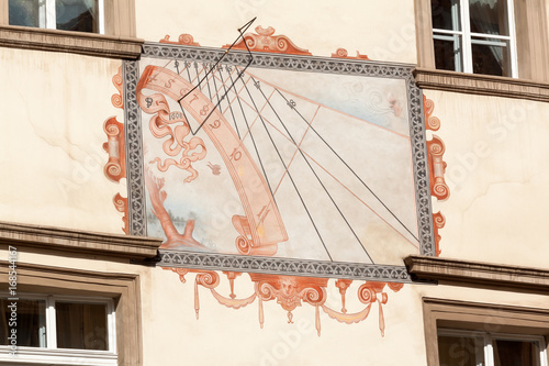Schilderij op canvas The detail of sundial from 17 century painted on facade of renaissance Velikov house in the eastern corner of Lesser Town Square and Tomasska street