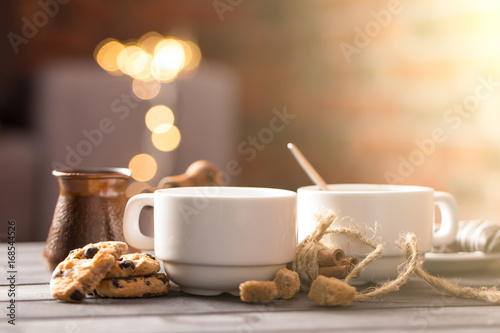 hot black coffee with cookies and beans in cafe