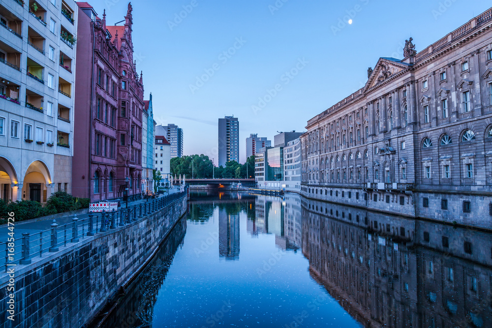 Architecture of city center with reflection in Spree river at dawn, Berlin. Germany