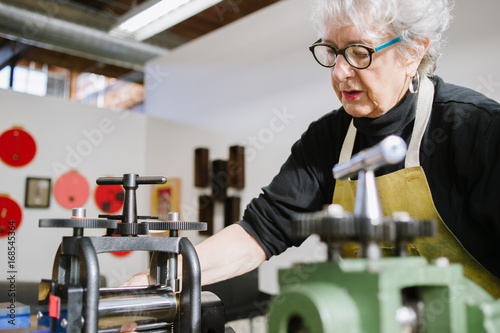 Art jewelery teacher showing process photo