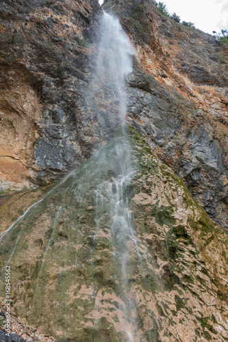 Rinka waterfall in beautiful Alpine valley  Logarska dolina - Logar valley in Slovenia