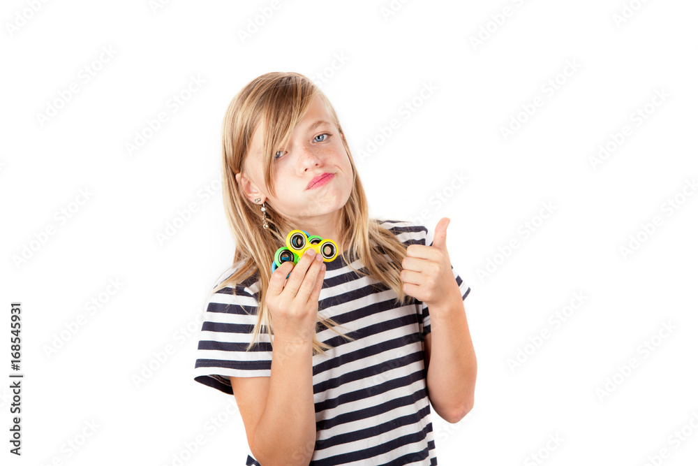 Young girl showing her fidget spinners proudly. Isolated on white background. Young girl showing her fidget spinners proudly. Isolated on white background.