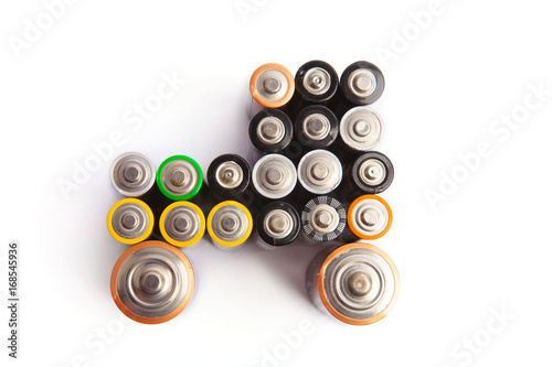 Car shape made from used aa batteries isolated on white