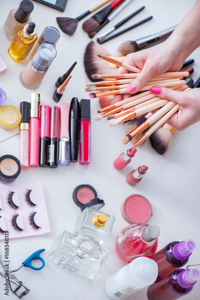 Collection of make up products displayed on the table Collection of make up products displayed on the table