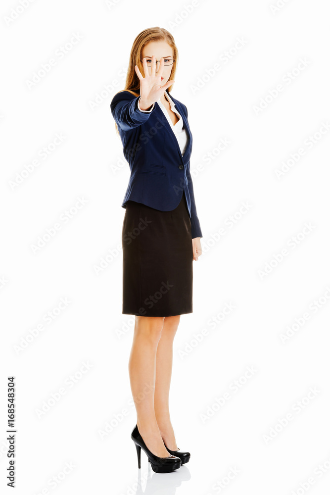 Beautiful business woman showing stop gesture by hand. Beautiful business woman showing stop gesture by hand.