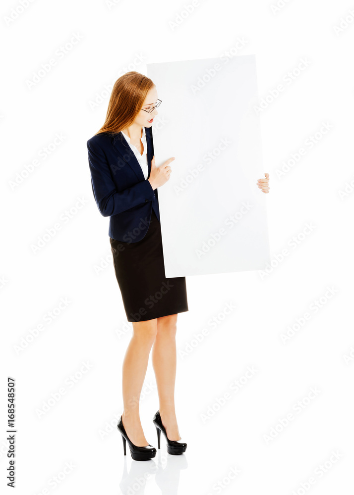 Beautiful business woman holding empty board, copy space. Beautiful business woman holding empty board, copy space.