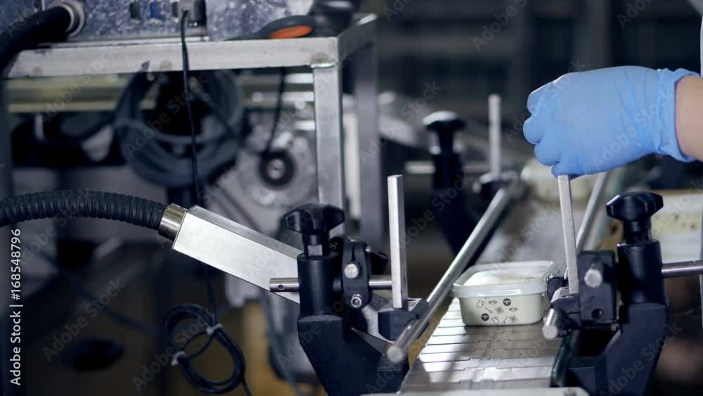 Factory worker control quality of product at food factory. Factory worker control quality of product at food factory.